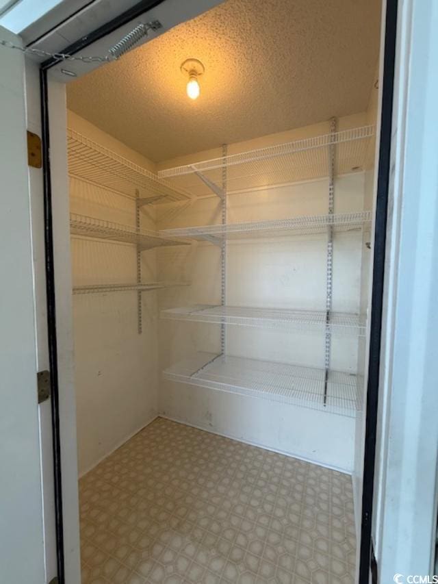 1980 Bent Grass Dr Unit F, Surfside Beach, SC 29575 - spacious closet featuring tile patterned floors