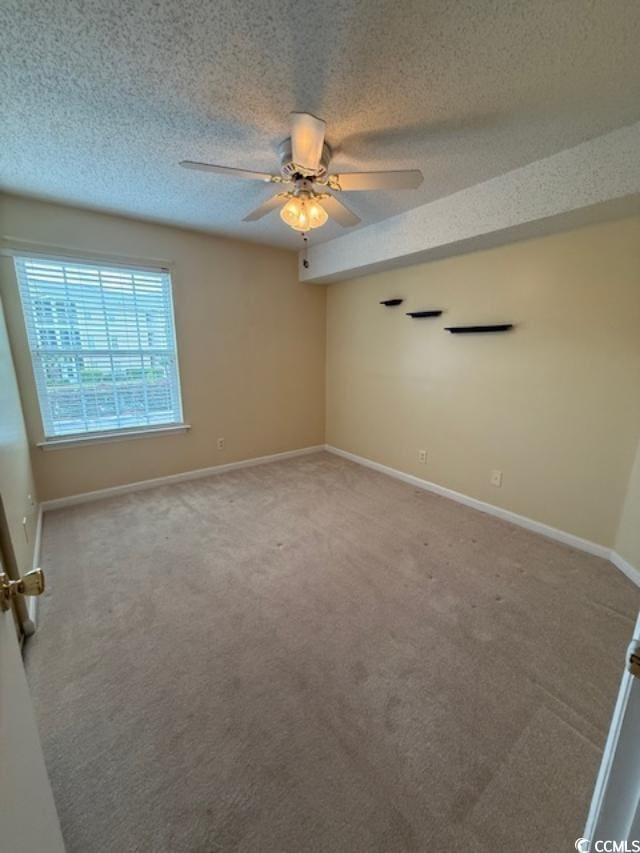 1980 Bent Grass Dr Unit F, Surfside Beach, SC 29575 - unfurnished room with ceiling fan, carpet floors, and a textured ceiling