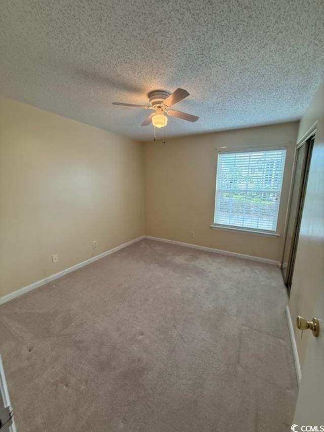 1980 Bent Grass Dr Unit F, Surfside Beach, SC 29575 - carpeted spare room featuring ceiling fan and a textured ceiling