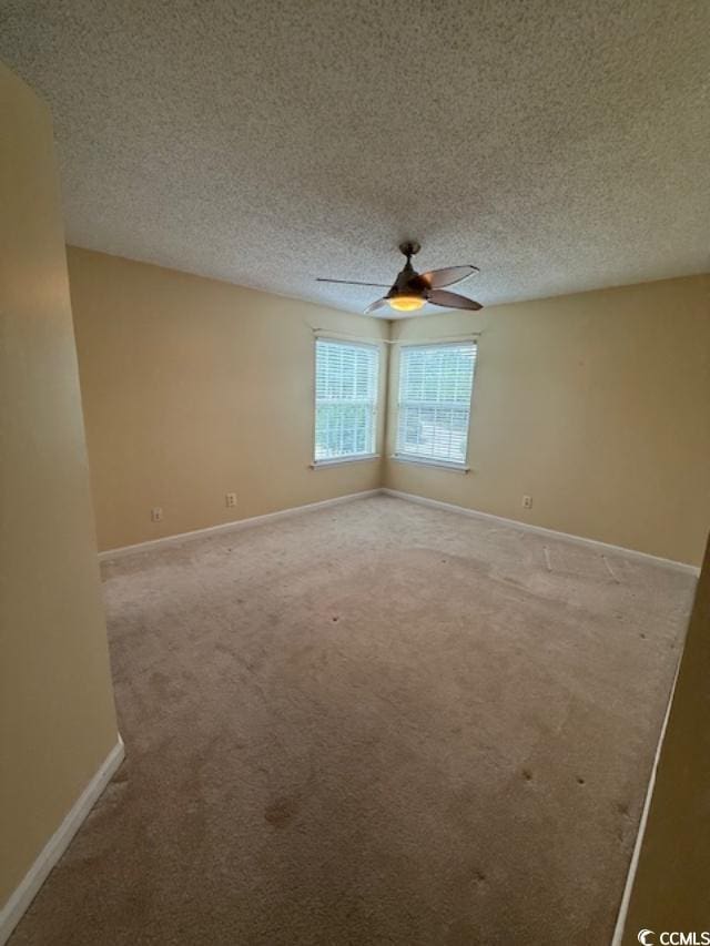 1980 Bent Grass Dr Unit F, Surfside Beach, SC 29575 - carpeted empty room featuring a ceiling fan and a textured ceiling