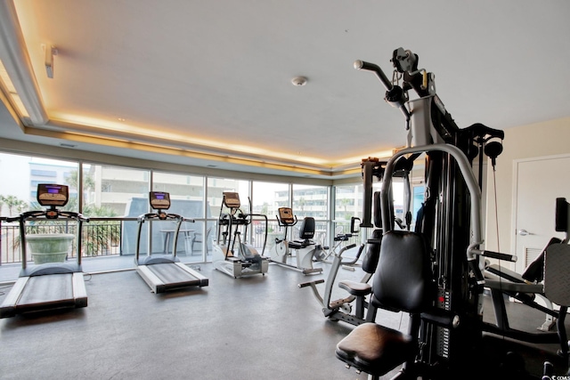 504 N Ocean Blvd Unit 1106, Myrtle Beach, SC 29577 - gym featuring healthy amount of natural light, a tray ceiling, and floor to ceiling windows