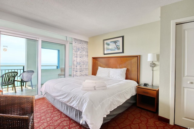 504 N Ocean Blvd Unit 1106, Myrtle Beach, SC 29577 - bedroom featuring a textured ceiling and access to exterior