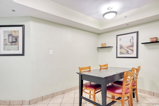 504 N Ocean Blvd Unit 1106, Myrtle Beach, SC 29577 - dining area with light tile patterned floors and baseboards