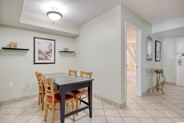 504 N Ocean Blvd Unit 1106, Myrtle Beach, SC 29577 - dining room with light tile patterned floors and baseboards