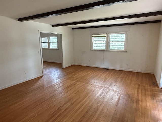 4909 Yaupon Cir, Myrtle Beach, SC 29575 - unfurnished room with light wood-type flooring, baseboards, and beam ceiling