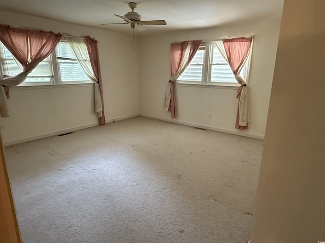 4909 Yaupon Cir, Myrtle Beach, SC 29575 - spare room with healthy amount of natural light, a ceiling fan, and light carpet