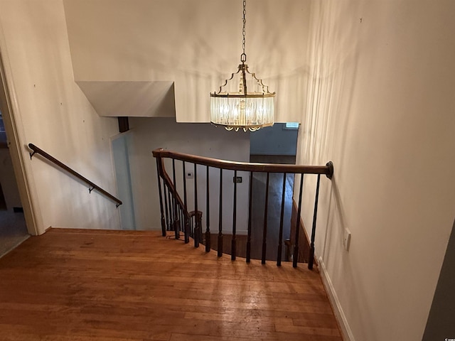 4909 Yaupon Cir, Myrtle Beach, SC 29575 - stairs with hardwood / wood-style flooring and a chandelier