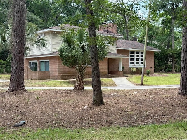 4909 Yaupon Cir, Myrtle Beach, SC 29575 - view of front of house with brick siding and a front yard