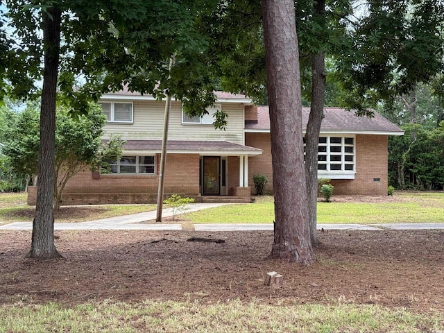 4909 Yaupon Cir, Myrtle Beach, SC 29575 - view of front of house featuring brick siding and a front lawn
