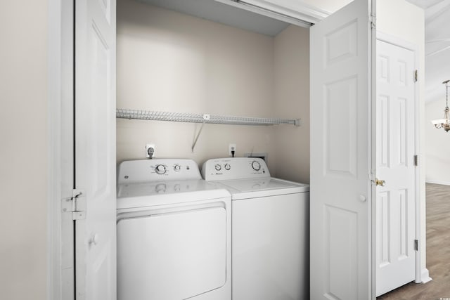9580 Kings Rd, Myrtle Beach, SC 29572 - laundry room featuring washer and clothes dryer and wood finished floors