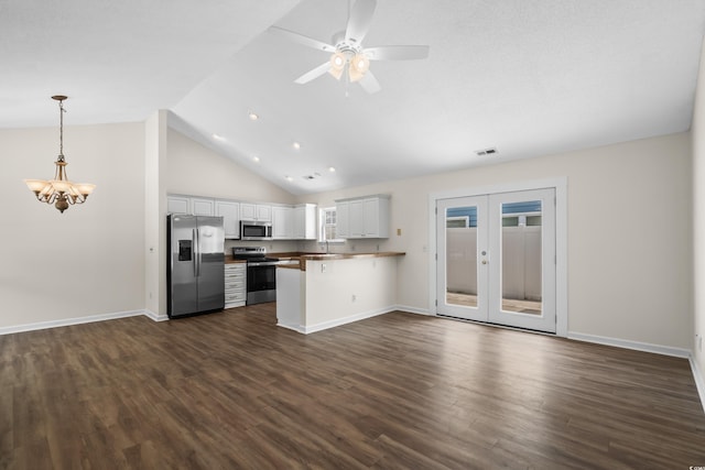 9580 Kings Rd, Myrtle Beach, SC 29572 - kitchen featuring appliances with stainless steel finishes, open floor plan, a peninsula, dark wood finished floors, and ceiling fan
