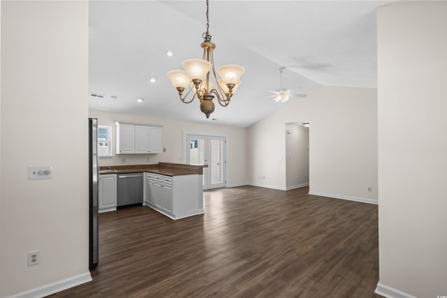 9580 Kings Rd, Myrtle Beach, SC 29572 - kitchen featuring stainless steel dishwasher, dark countertops, vaulted ceiling, a peninsula, and open floor plan