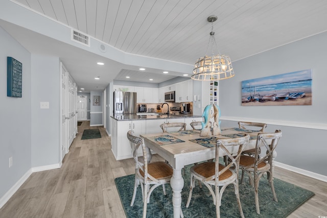 1625 S Ocean Blvd Unit 211, North Myrtle Beach, SC 29582 - dining room featuring light wood-style floors, a chandelier, recessed lighting, and wood ceiling