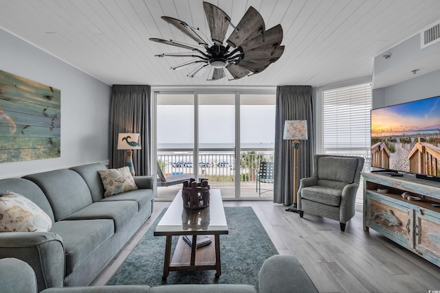 1625 S Ocean Blvd Unit 211, North Myrtle Beach, SC 29582 - living area with expansive windows, wood ceiling, and wood finished floors