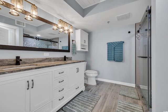 1625 S Ocean Blvd Unit 211, North Myrtle Beach, SC 29582 - full bath featuring wood finished floors, a stall shower, double vanity, and a chandelier