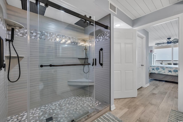 1625 S Ocean Blvd Unit 211, North Myrtle Beach, SC 29582 - bathroom featuring wood finished floors, a shower stall, connected bathroom, and wooden ceiling