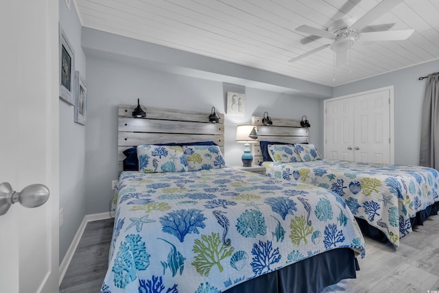 1625 S Ocean Blvd Unit 211, North Myrtle Beach, SC 29582 - bedroom with wooden ceiling, wood finished floors, a ceiling fan, and a closet