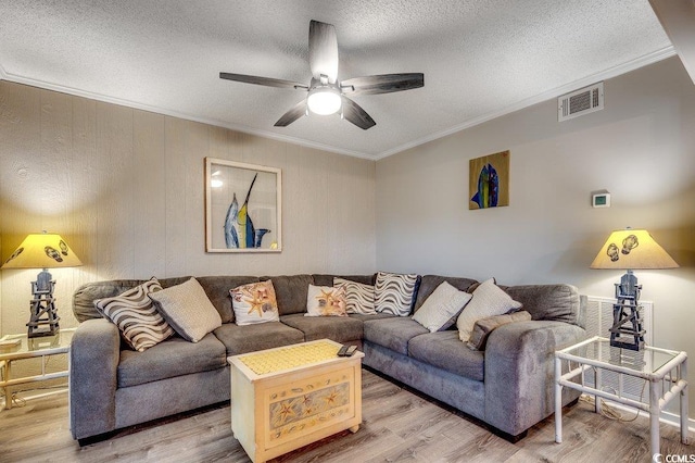 211 N Hillside Dr Unit 204, North Myrtle Beach, SC 29582 - living room featuring crown molding, a ceiling fan, wood finished floors, and a textured ceiling