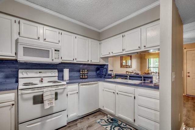 211 N Hillside Dr Unit 204, North Myrtle Beach, SC 29582 - kitchen with white appliances, a textured ceiling, light wood-type flooring, crown molding, and white cabinetry