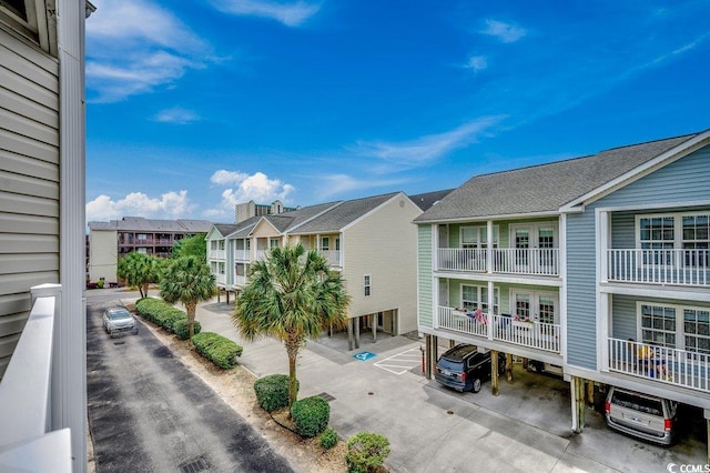 211 N Hillside Dr Unit 204, North Myrtle Beach, SC 29582 - view of property featuring a residential view and covered parking