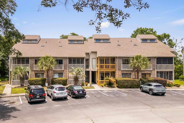 1356 Glenns Bay Rd Unit A202, Surfside Beach, SC 29575 - view of building exterior featuring uncovered parking