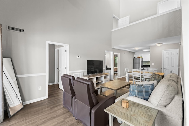 1356 Glenns Bay Rd Unit A202, Surfside Beach, SC 29575 - living room with a high ceiling and light wood-style floors