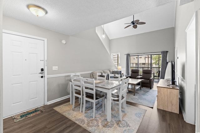 1356 Glenns Bay Rd Unit A202, Surfside Beach, SC 29575 - dining room with ceiling fan, dark wood-type flooring, a textured ceiling, and a high ceiling