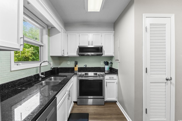 1356 Glenns Bay Rd Unit A202, Surfside Beach, SC 29575 - kitchen featuring stainless steel appliances, white cabinetry, backsplash, and dark wood-type flooring