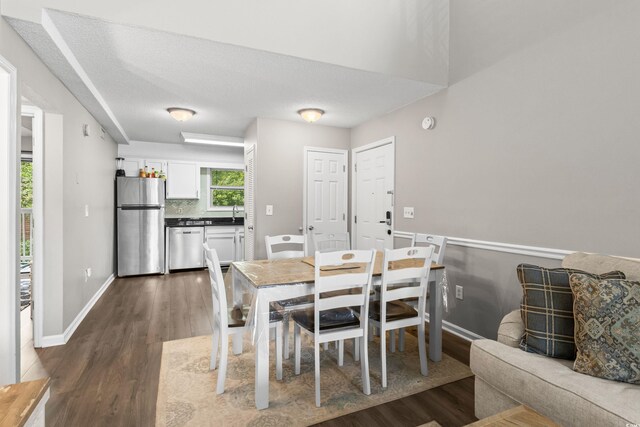 1356 Glenns Bay Rd Unit A202, Surfside Beach, SC 29575 - dining area with dark wood finished floors and baseboards
