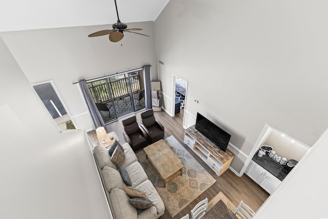 1356 Glenns Bay Rd Unit A202, Surfside Beach, SC 29575 - living area featuring high vaulted ceiling, wood finished floors, plenty of natural light, and ceiling fan