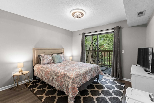 1356 Glenns Bay Rd Unit A202, Surfside Beach, SC 29575 - bedroom with wood finished floors, access to exterior, and a textured ceiling