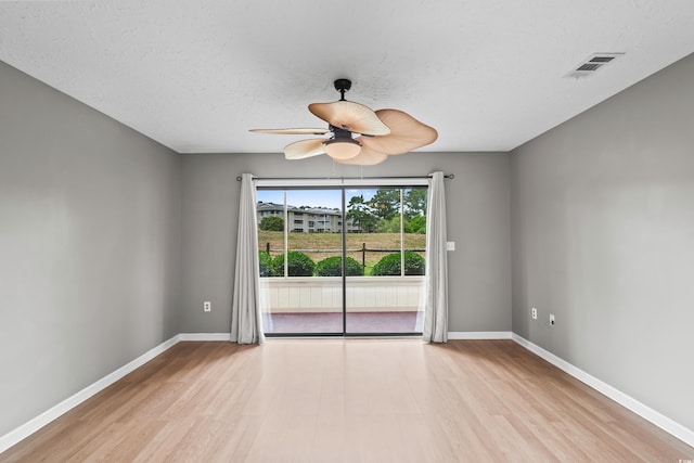 4101 Pinehurst Cir Unit Aa-3, Little River, SC 29566 - spare room with wood finished floors, ceiling fan, baseboards, and a textured ceiling