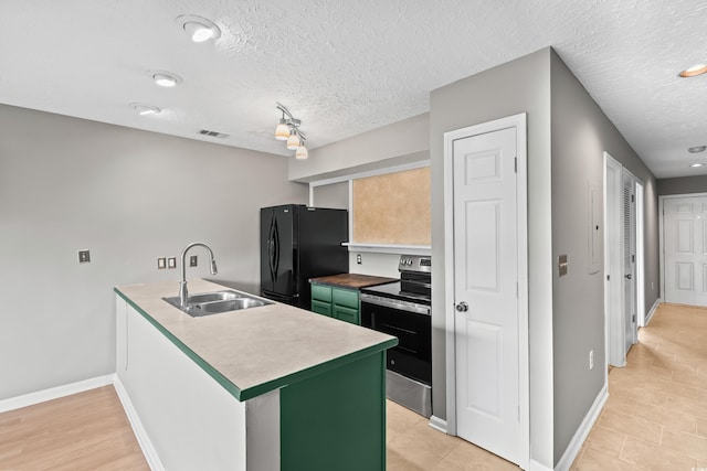 4101 Pinehurst Cir Unit Aa-3, Little River, SC 29566 - kitchen featuring stainless steel range with electric cooktop, a sink, green cabinetry, freestanding refrigerator, and a peninsula