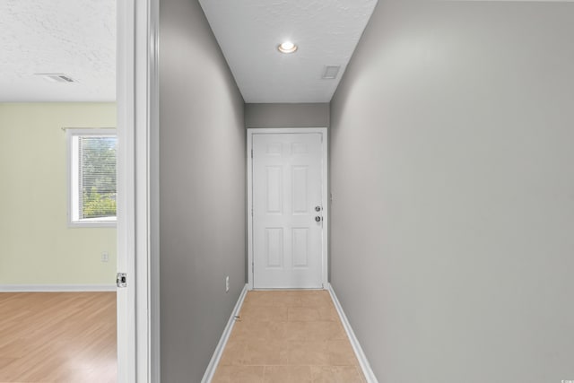 4101 Pinehurst Cir Unit Aa-3, Little River, SC 29566 - hallway featuring baseboards and a textured ceiling