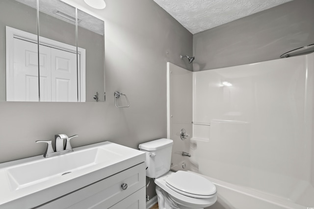 4101 Pinehurst Cir Unit Aa-3, Little River, SC 29566 - bathroom featuring vanity, a textured ceiling, toilet, and  shower combination