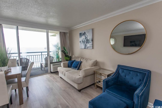 1105 S Ocean Blvd Unit 932, Myrtle Beach, SC 29577 - living room with wood finished floors, crown molding, and a textured ceiling
