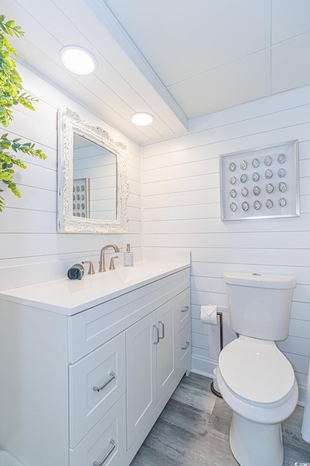 161 Sea Watch Dr Unit 601, Myrtle Beach, SC 29572 - bathroom featuring vanity, wood finished floors, wood walls, and recessed lighting