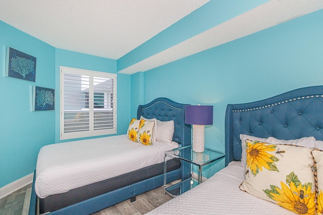 161 Sea Watch Dr Unit 601, Myrtle Beach, SC 29572 - bedroom with wood finished floors and baseboards