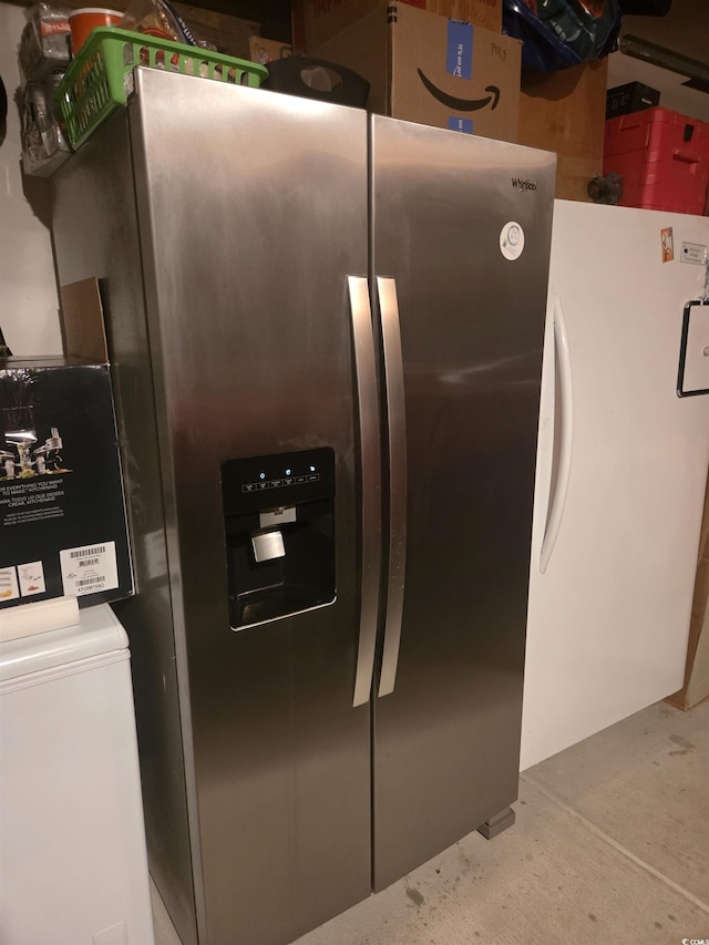 297 Harvest Ridge Way, Conway, SC 29527 - detailed view of stainless steel fridge with ice dispenser and concrete floors