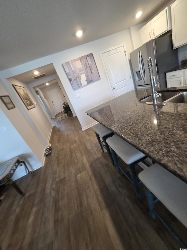 297 Harvest Ridge Way, Conway, SC 29527 - kitchen featuring stainless steel refrigerator with ice dispenser, a sink, dark wood-type flooring, dark stone countertops, and recessed lighting
