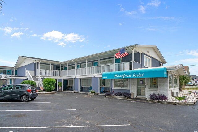 5409 N Ocean Blvd Unit 100, North Myrtle Beach, SC 29582 - view of property featuring uncovered parking