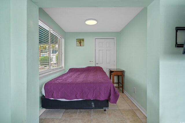 5409 N Ocean Blvd Unit 100, North Myrtle Beach, SC 29582 - bedroom with baseboards and tile patterned floors