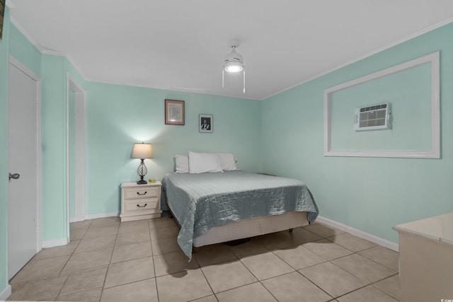 5409 N Ocean Blvd Unit 100, North Myrtle Beach, SC 29582 - bedroom with a wall unit AC, tile patterned floors, ornamental molding, baseboards, and ceiling fan