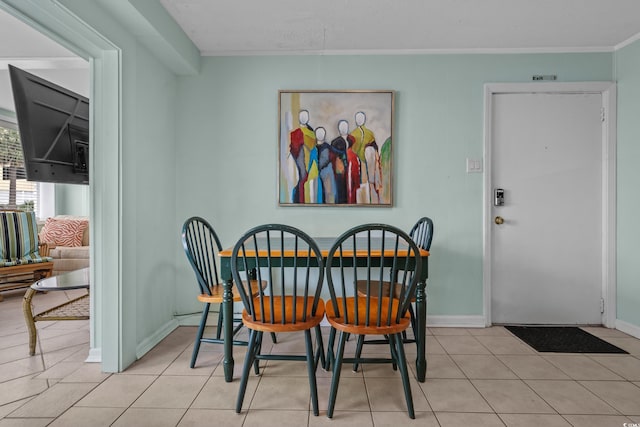 5409 N Ocean Blvd Unit 100, North Myrtle Beach, SC 29582 - tiled dining area featuring baseboards and ornamental molding