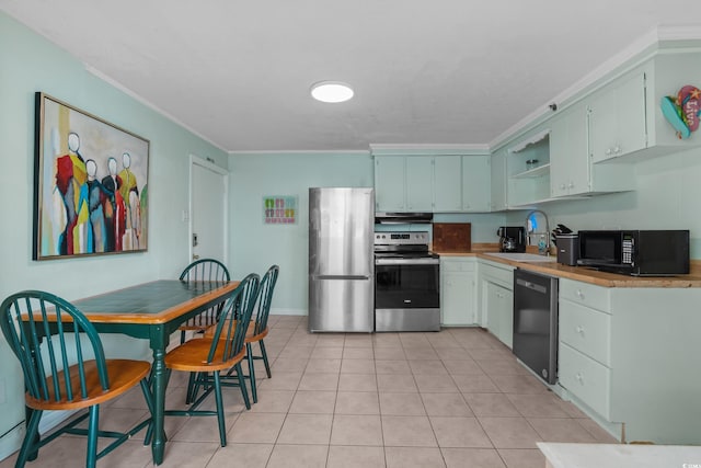 5409 N Ocean Blvd Unit 100, North Myrtle Beach, SC 29582 - kitchen with stainless steel appliances, a sink, open shelves, ornamental molding, and light tile patterned floors