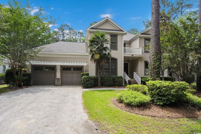 346 Tuckers Rd Unit A, Pawleys Island, SC 29585 - view of property with a garage, driveway, and a shingled roof