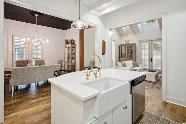 346 Tuckers Rd Unit A, Pawleys Island, SC 29585 - kitchen with a chandelier, a sink, light wood-style floors, open floor plan, and pendant lighting