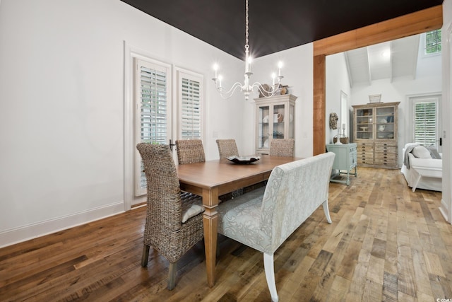 346 Tuckers Rd Unit A, Pawleys Island, SC 29585 - dining room with a chandelier, wood-type flooring, and baseboards