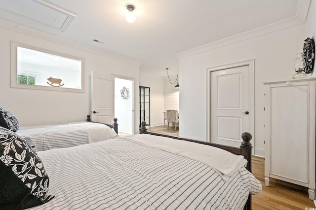 346 Tuckers Rd Unit A, Pawleys Island, SC 29585 - bedroom with light wood-type flooring and ornamental molding