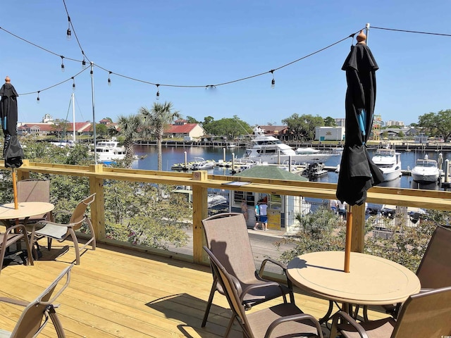 6015 Catalina Dr Unit 732, North Myrtle Beach, SC 29582 - deck with a water view and outdoor dining space